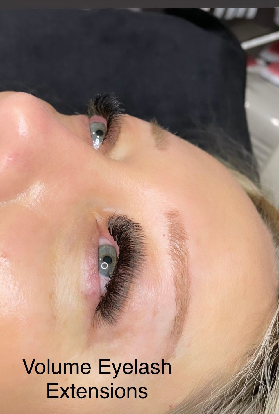 A close up of a woman 's face with volume eyelash extensions.