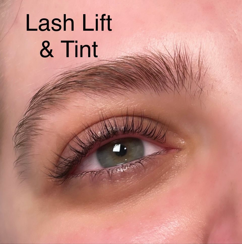 A close up of a woman 's eye with lash lift and tint