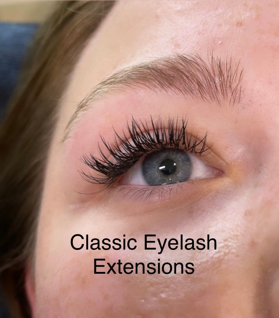 A close up of a woman 's eye with classic eyelash extensions.