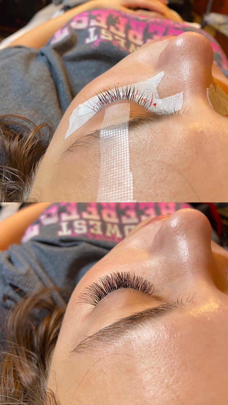 A woman is getting her eyelashes done in a salon.