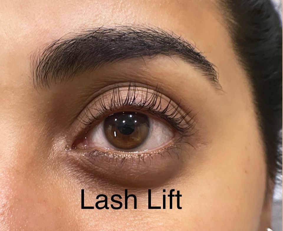 A close up of a woman 's eye with lashes lifted.