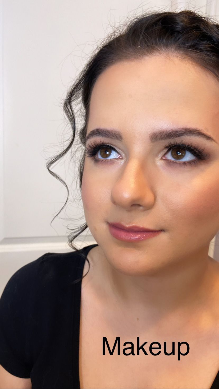A close up of a woman 's face with makeup on.