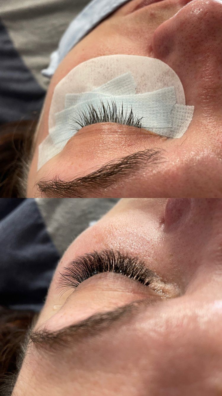 A close up of a woman 's eye with false eyelashes.