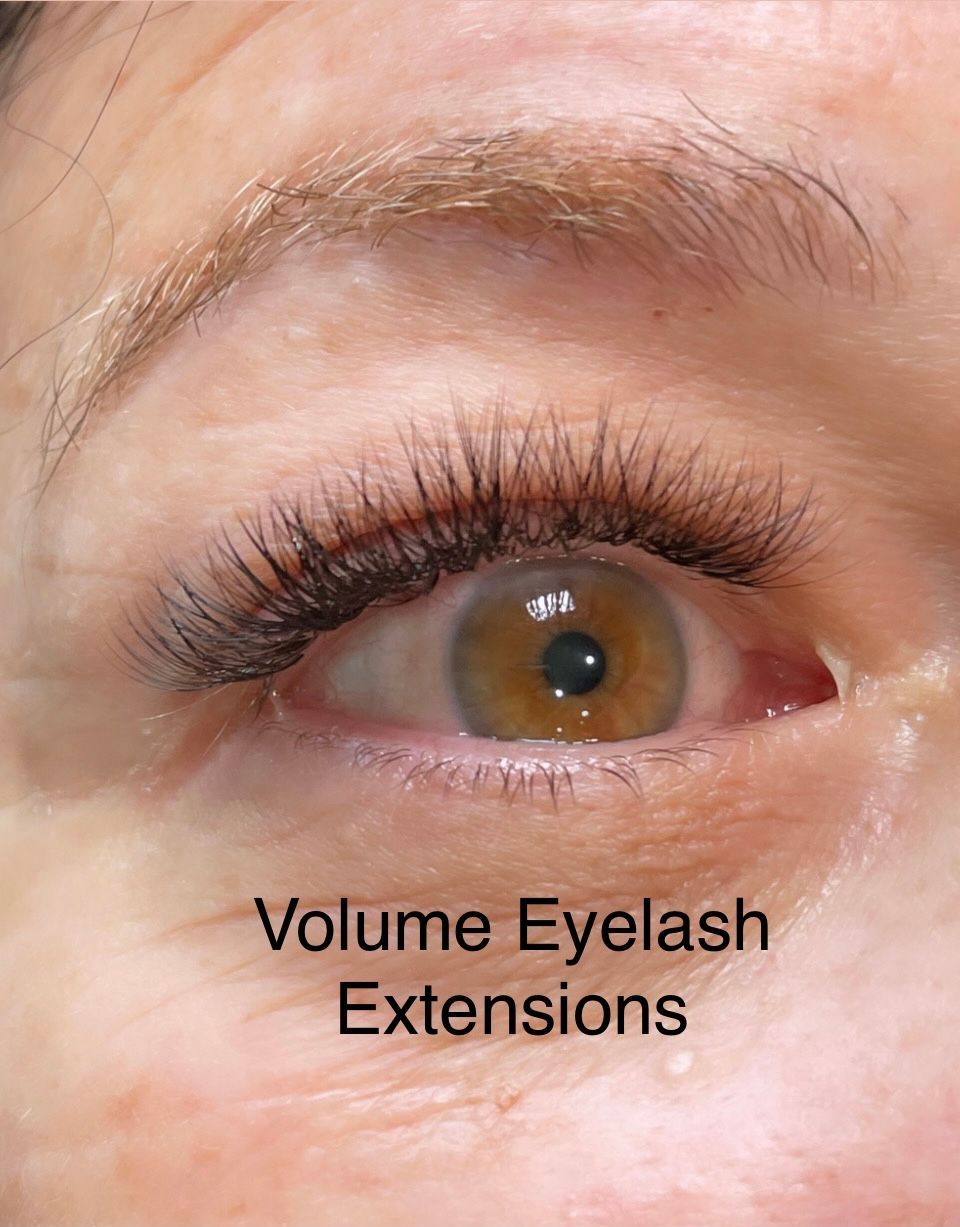 A close up of a woman 's eye with volume eyelash extensions.