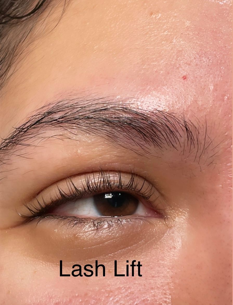 A close up of a woman 's eye with lashes lifted.