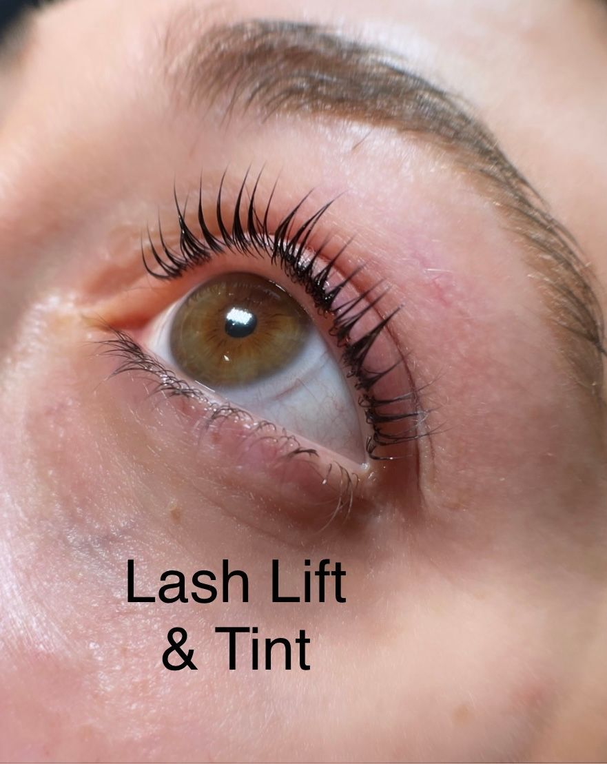 A close up of a woman 's eye with lash lift and tint
