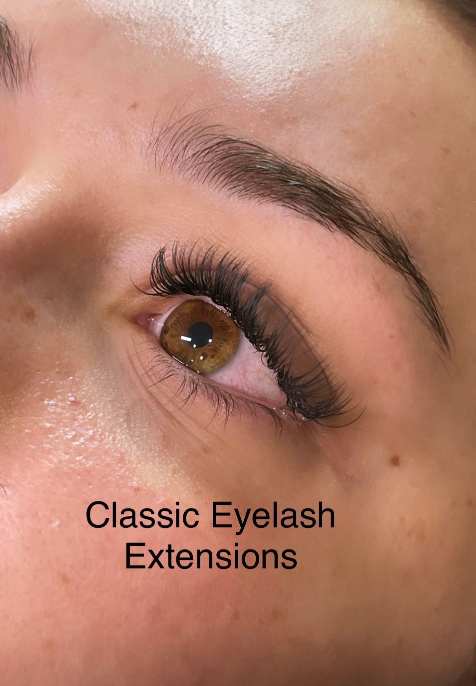 A close up of a woman 's eye with classic eyelash extensions.