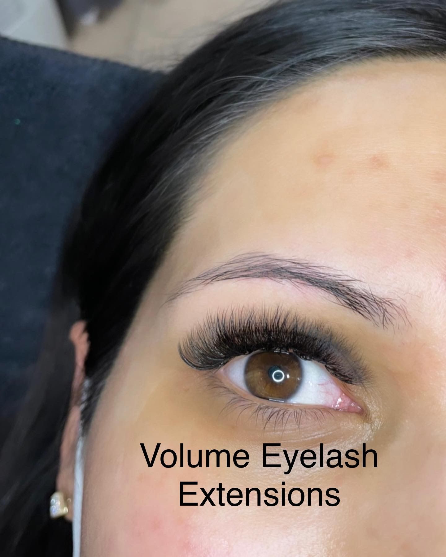 A close up of a woman 's eye with volume eyelash extensions