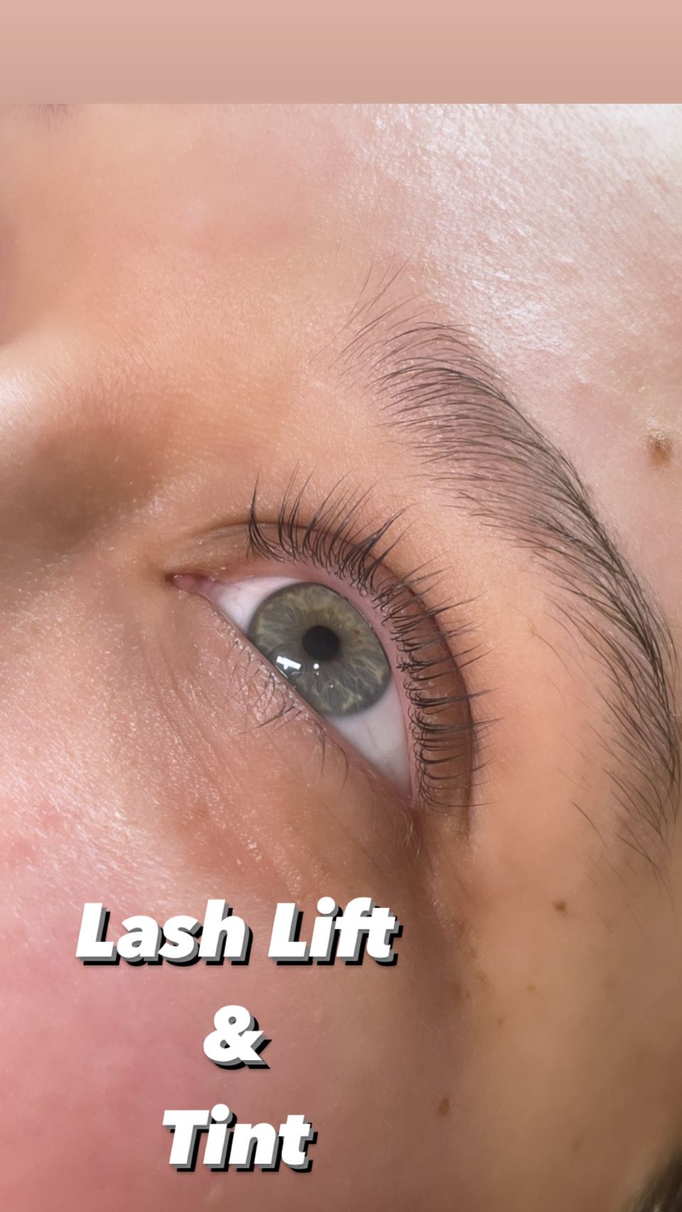 A close up of a woman 's eye with lash lift and tint.