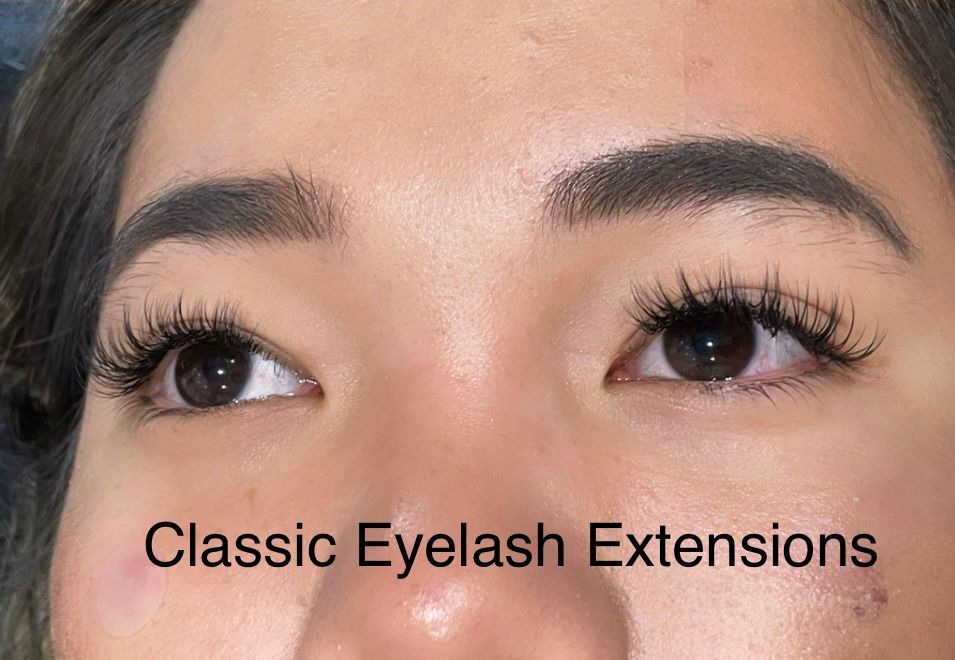A close up of a woman 's eyes with classic eyelash extensions.