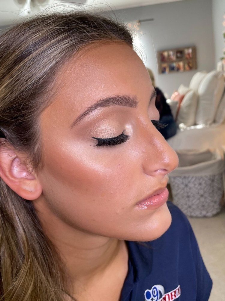 A close up of a woman 's face with makeup on.