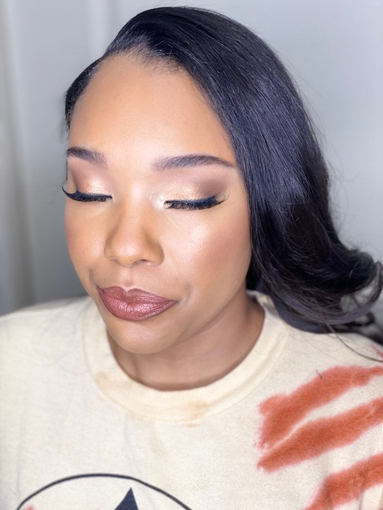 A close up of a woman 's face with her eyes closed.