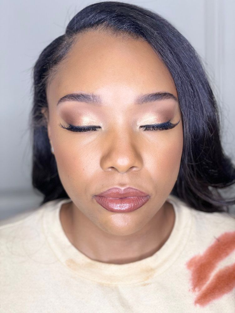 A close up of a woman 's face with her eyes closed.