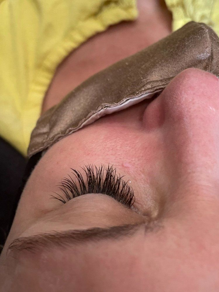 A close up of a woman 's face with a mask on it.