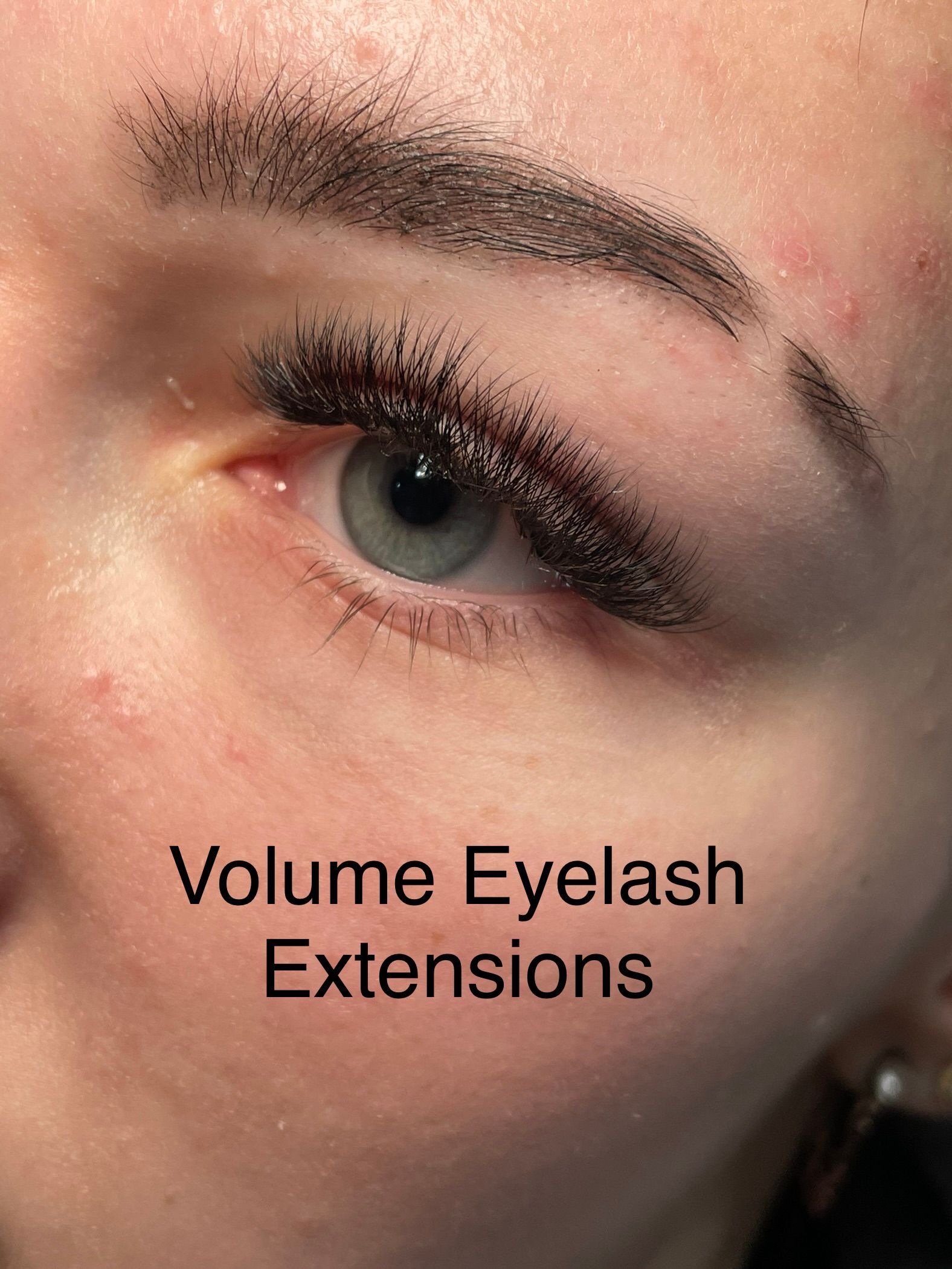 A close up of a woman 's eye with volume eyelash extensions.