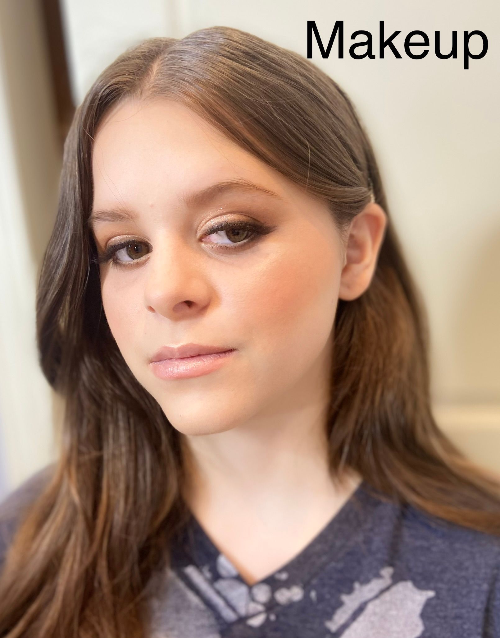 A close up of a woman 's face with the word makeup above her