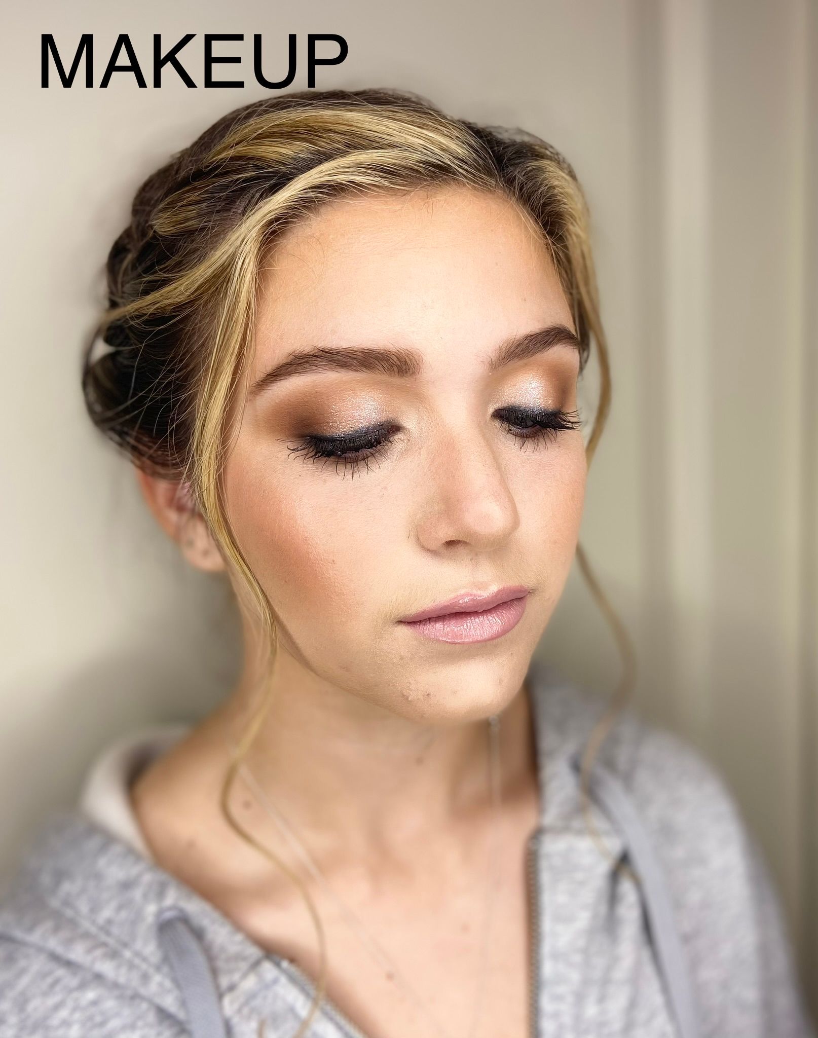 A close up of a woman 's face with makeup on.