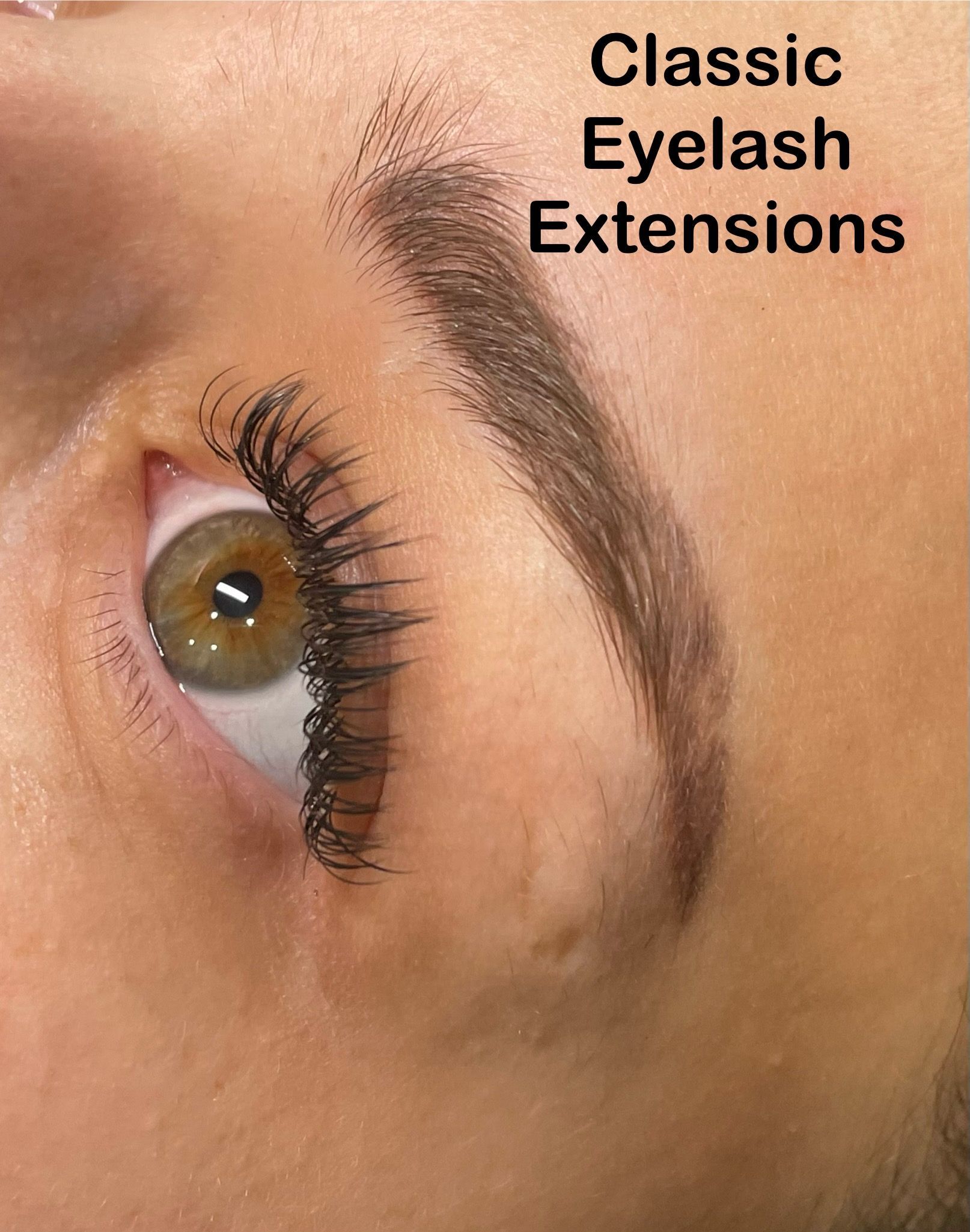 A close up of a woman 's eye with classic eyelash extensions