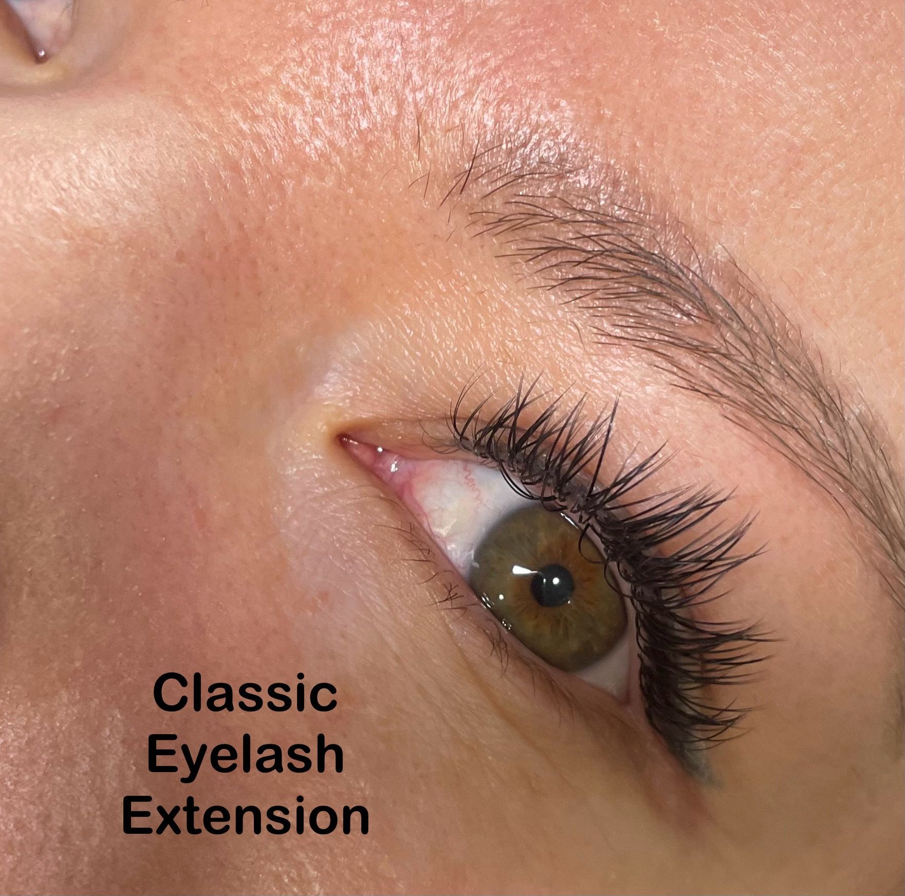 A close up of a woman 's eye with classic eyelash extension
