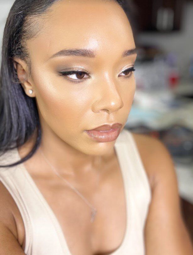 A close up of a woman 's face with makeup on.