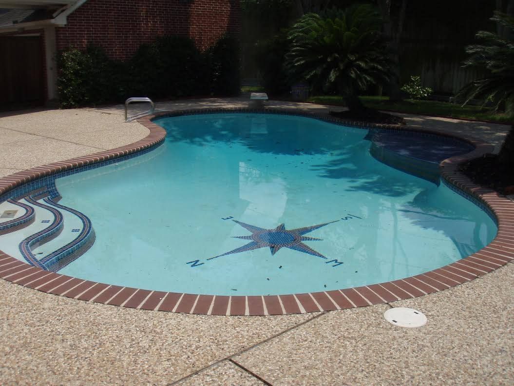 A large swimming pool with a star in the middle