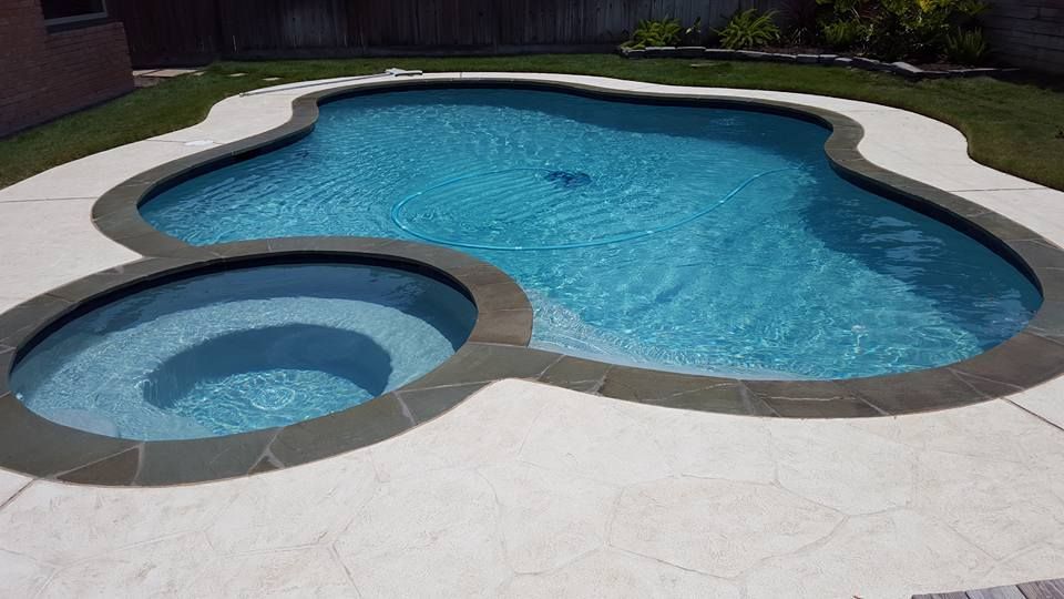 A large swimming pool with a swirl in the middle