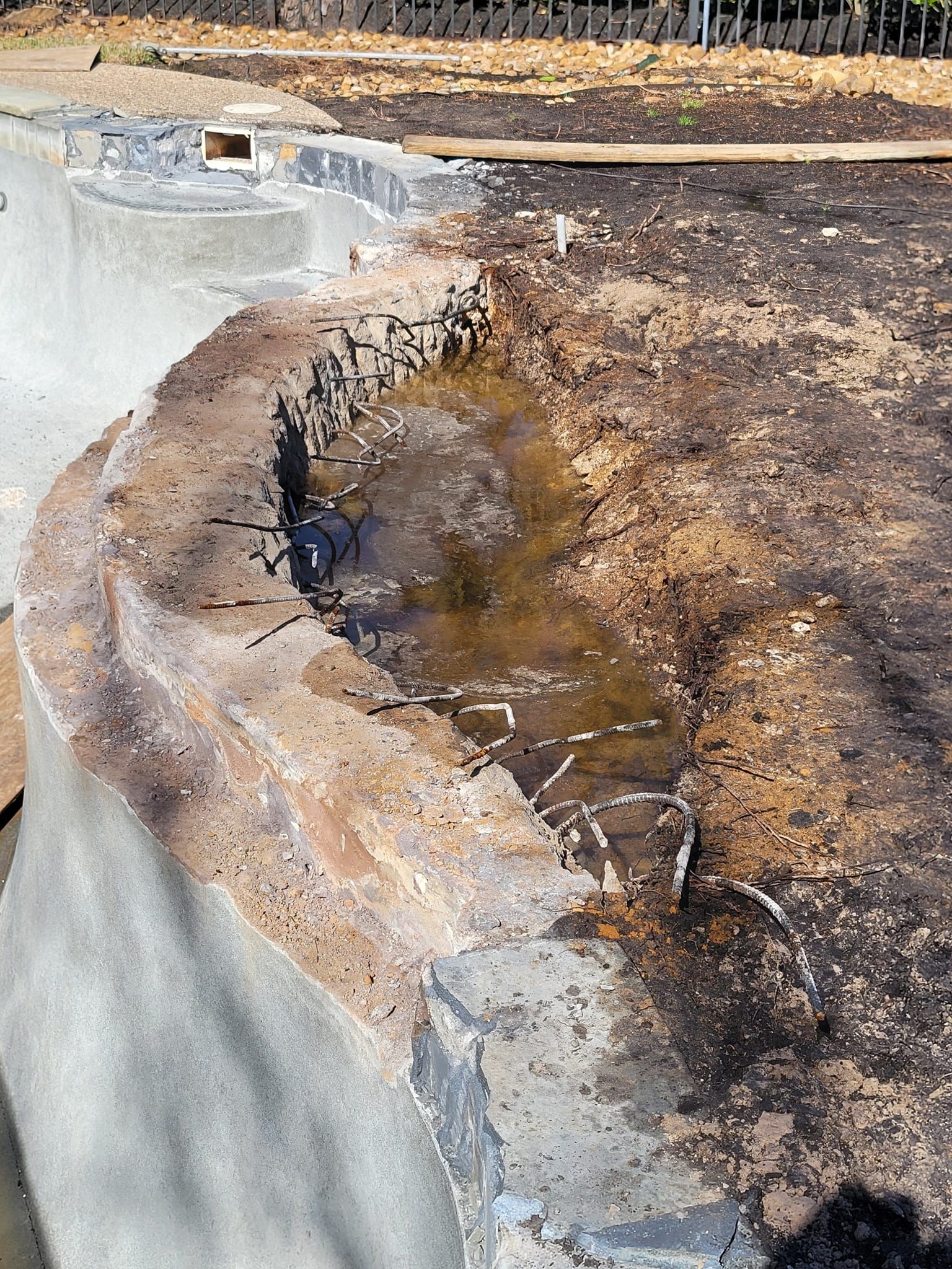 A large rock with water coming out of it.