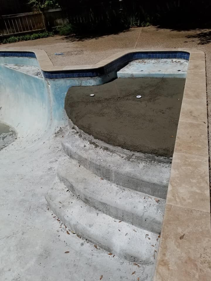 A swimming pool with stairs leading up to it.