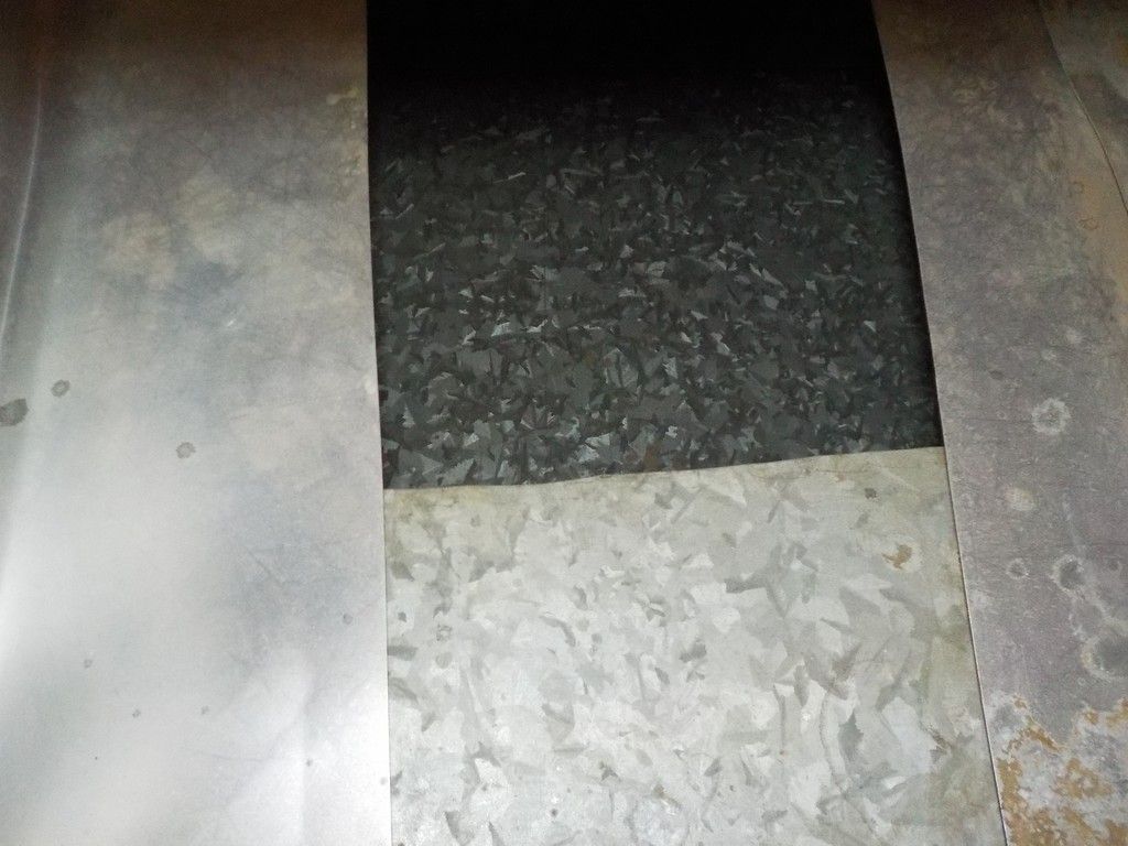 A close up of a piece of metal on a floor.