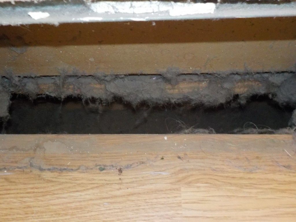 A close up of a piece of metal on a floor.