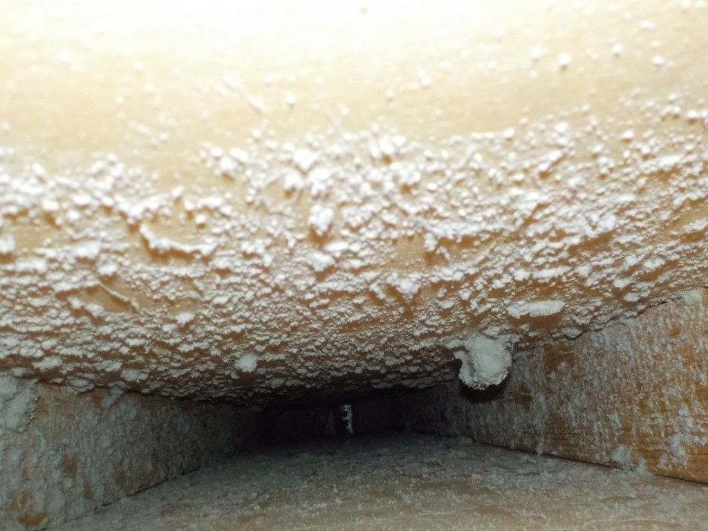 It looks like a tunnel with a lot of white foam coming out of it.