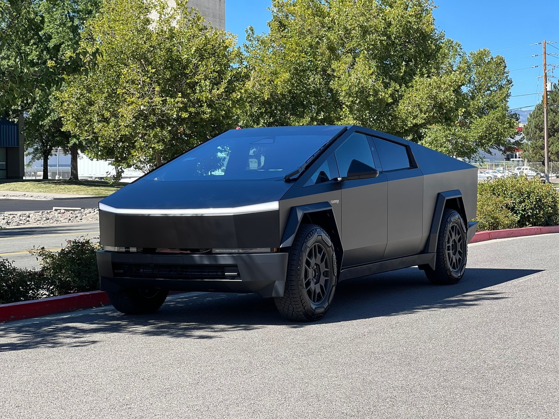 A close up of the back of a tesla model s truck.