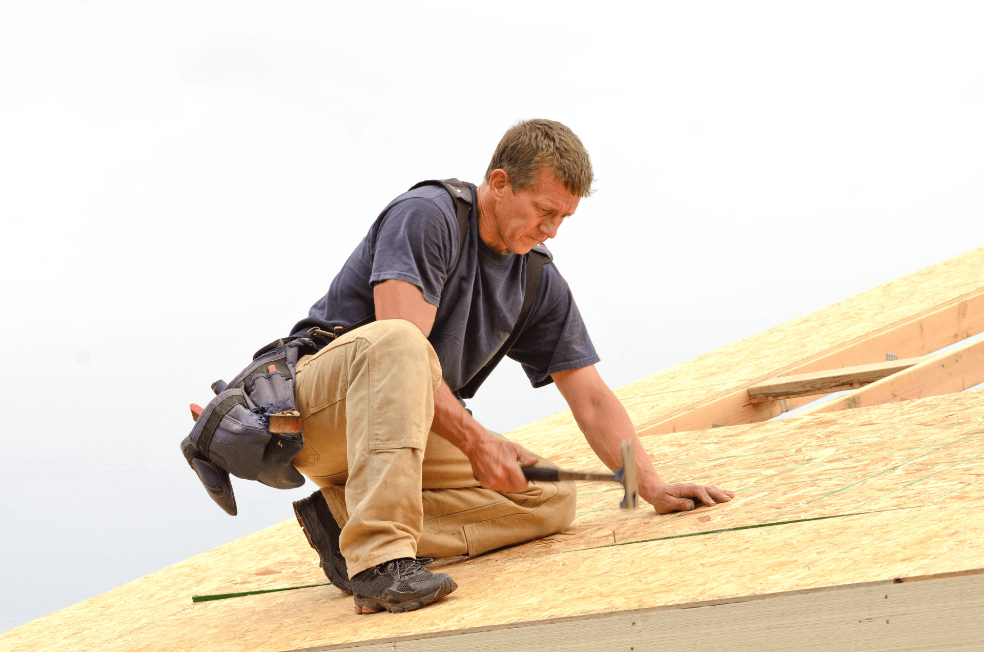 Plywood being installed for shingles on an ACE Roofing Project