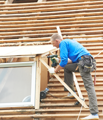 ACE employee working on Roofs & Windows