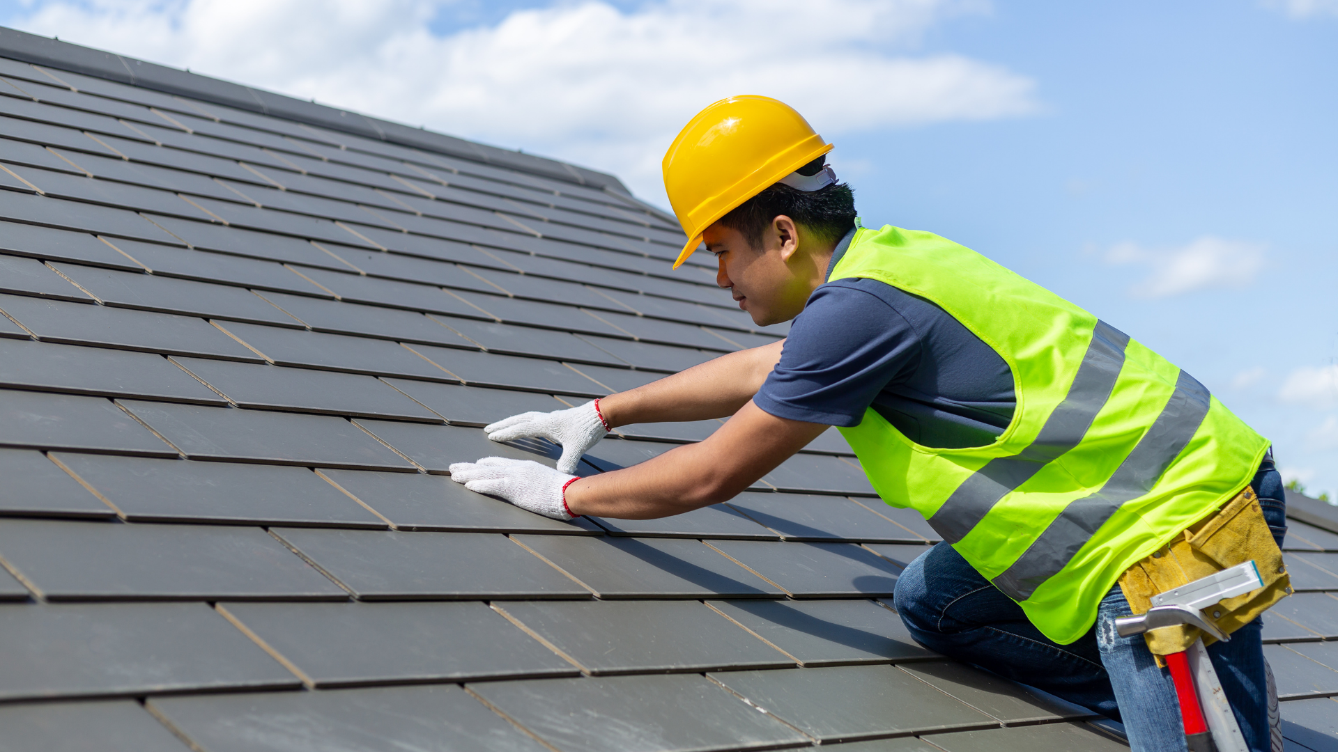 Ace Worker installing shingles wearing the appropriate safety gear