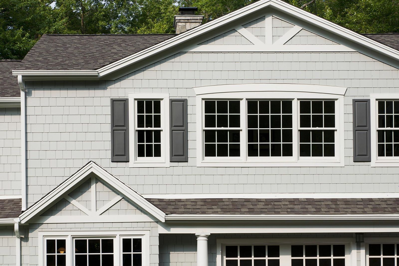 A white house with a garage and a lot of windows