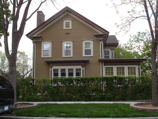 A large house with a car parked in front of it