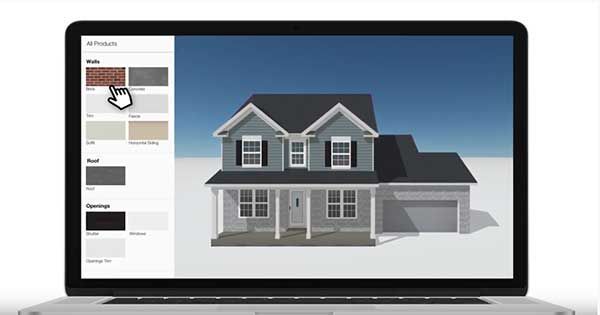 A laptop with a picture of a house on the screen.