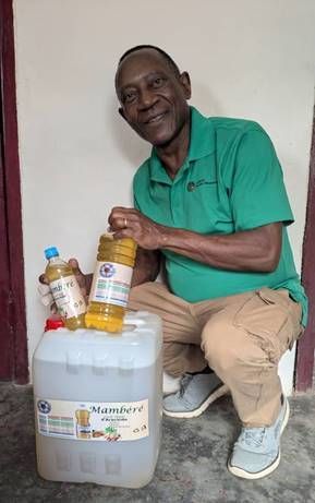 Willie Langdji, ELCA representative to CAR, with bottled peanut oil