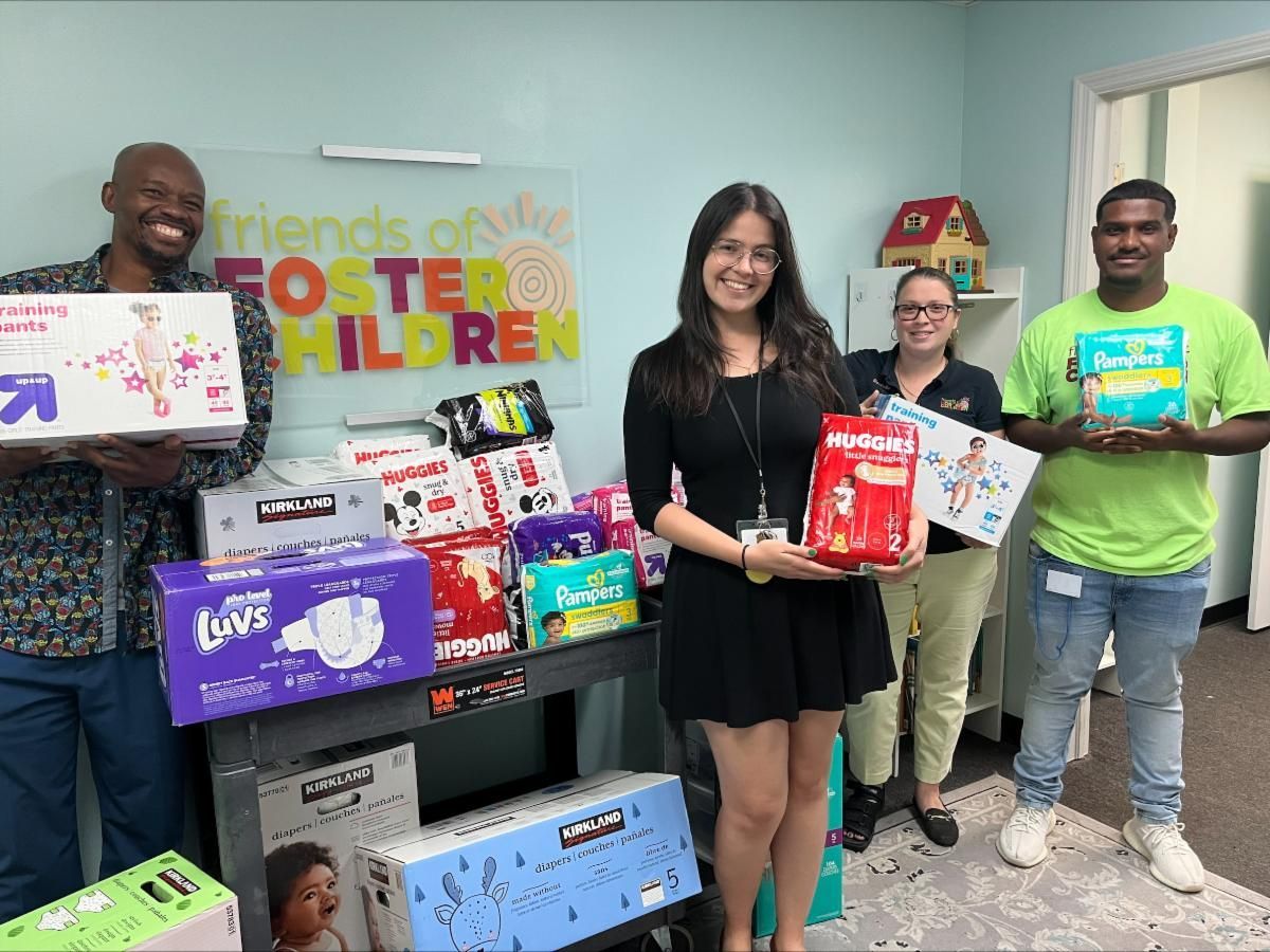 FFC Team holding supplies from the Resource Center.
