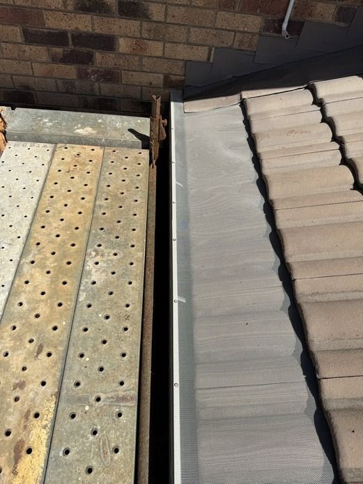 Man Installing House Roof Rain Gutter System — Guttering In Lismore NSW