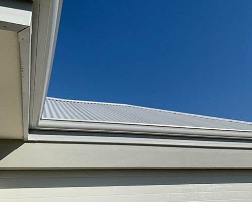 White Metal Roofing  — Guttering In Lismore NSW