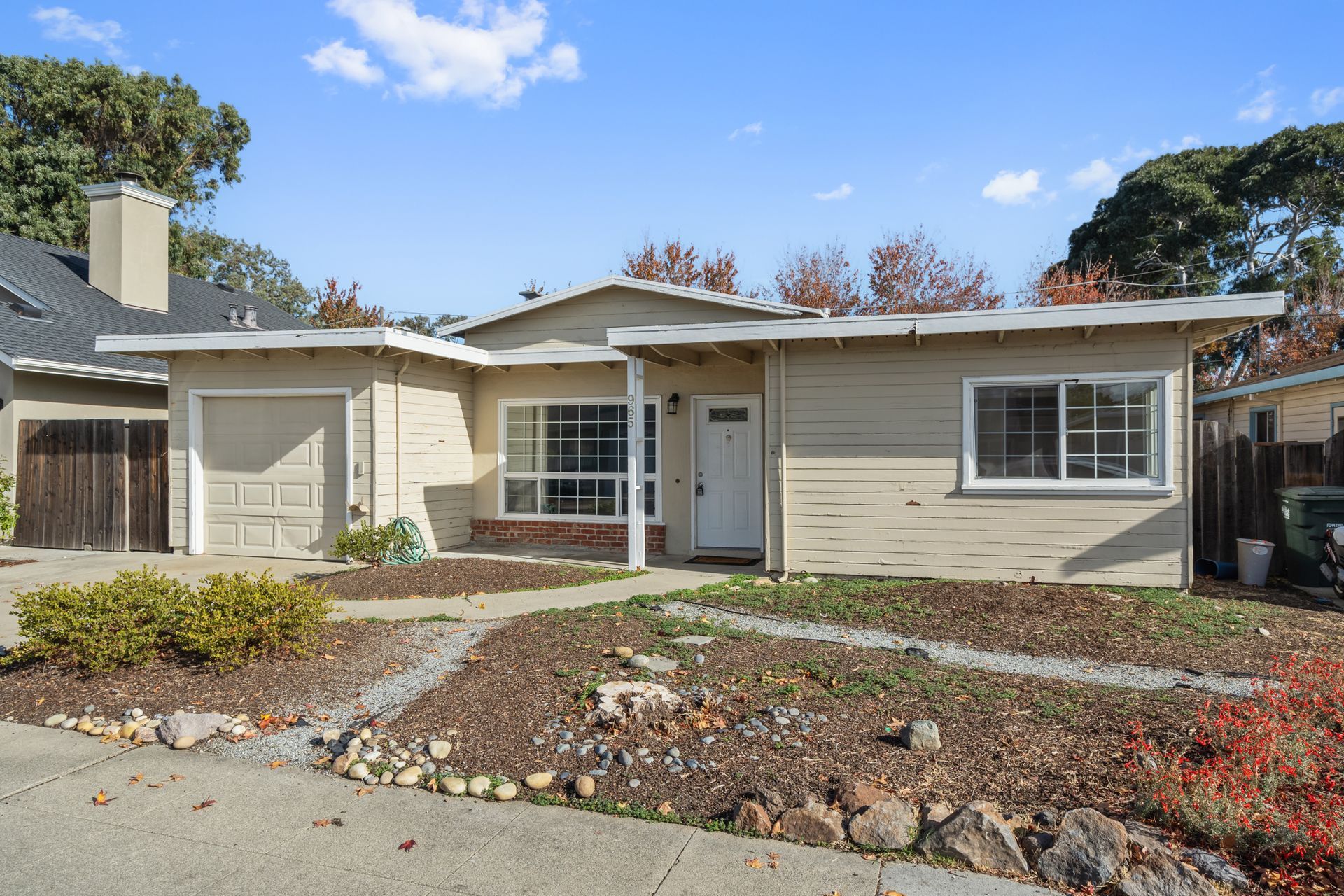 The front of a house with a garage and a porch