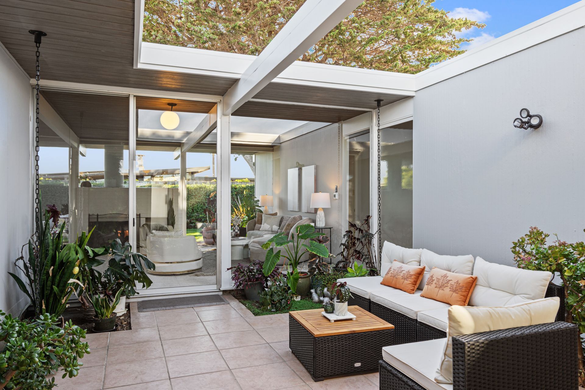 A patio with a couch and a table in a house