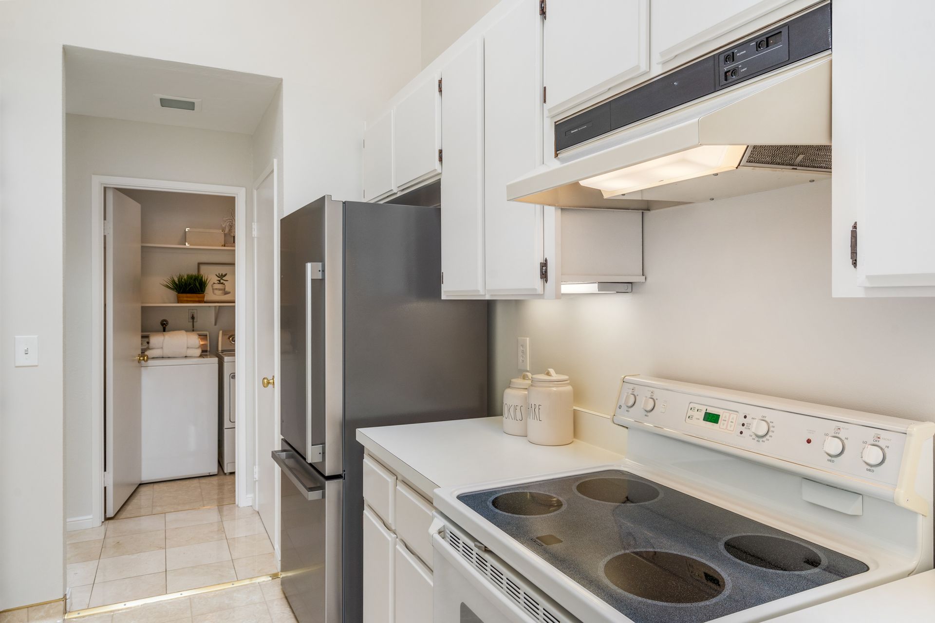 A kitchen with a stove , refrigerator , and dishwasher.