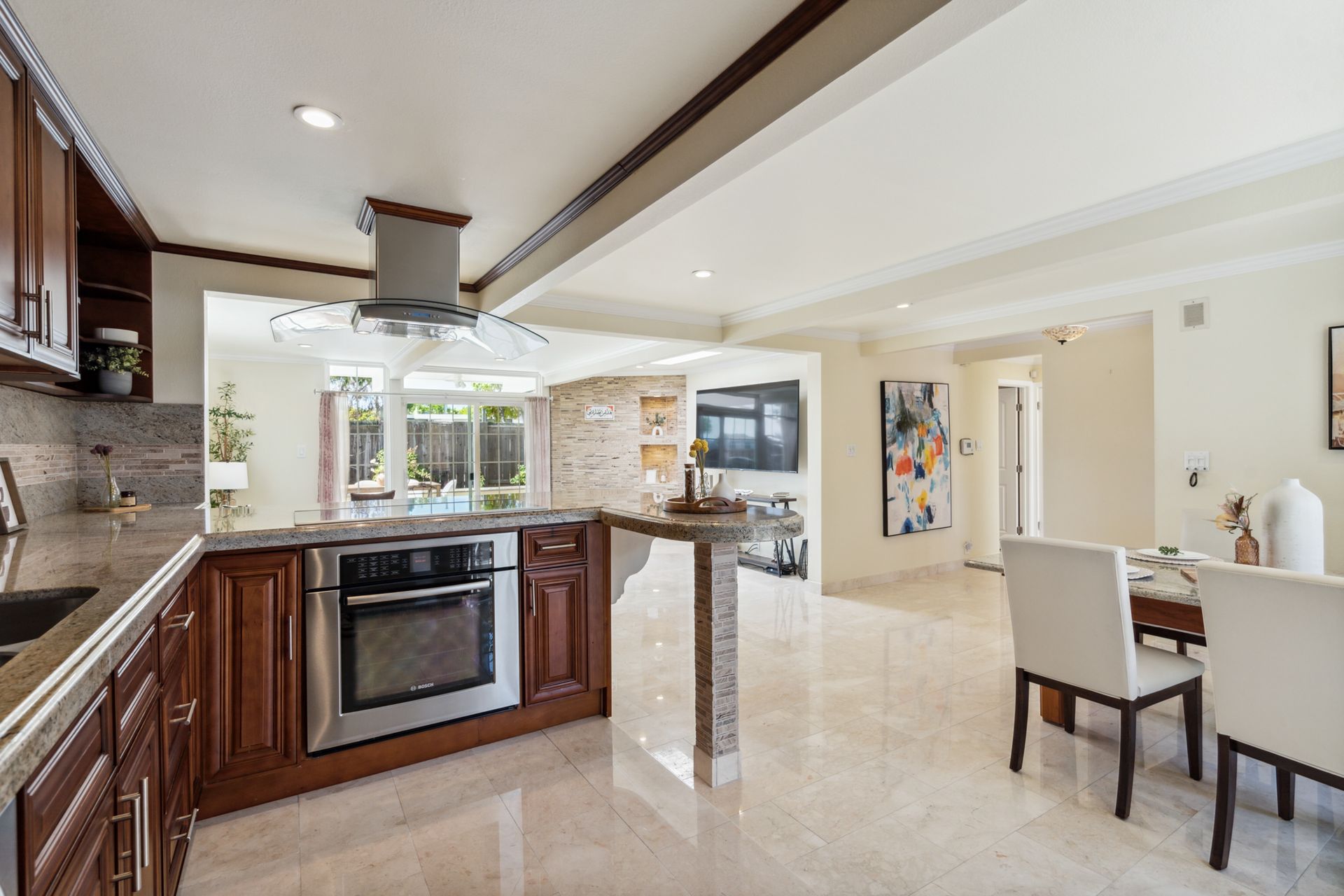A kitchen with stainless steel appliances and wooden cabinets