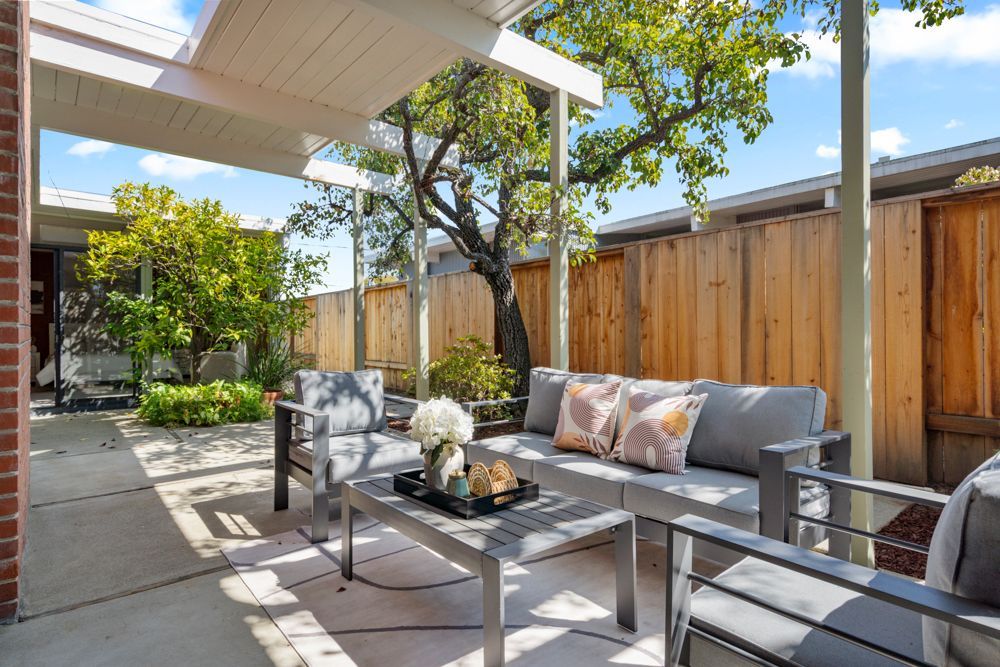 Private backyard with patio and garden vignettes, presented by Rumana Jabeen & Associates to illustrate lifestyle buyers seek and sellers can confidently showcase.