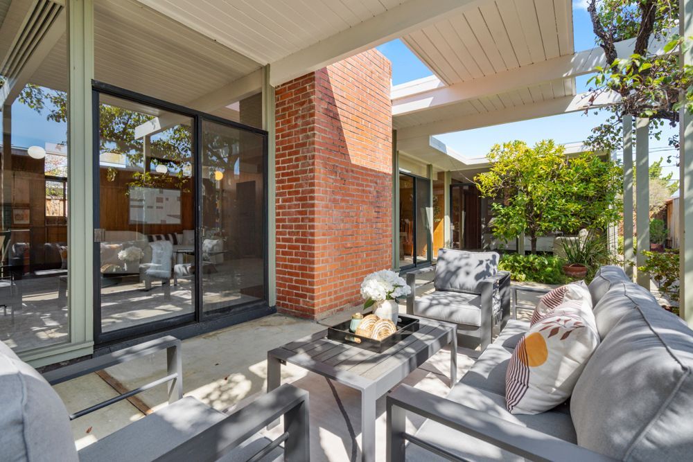 Private backyard with patio and garden vignettes, presented by Rumana Jabeen & Associates to illustrate lifestyle buyers seek and sellers can confidently showcase.