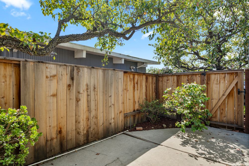 Private backyard with patio and garden vignettes, presented by Rumana Jabeen & Associates to illustrate lifestyle buyers seek and sellers can confidently showcase.