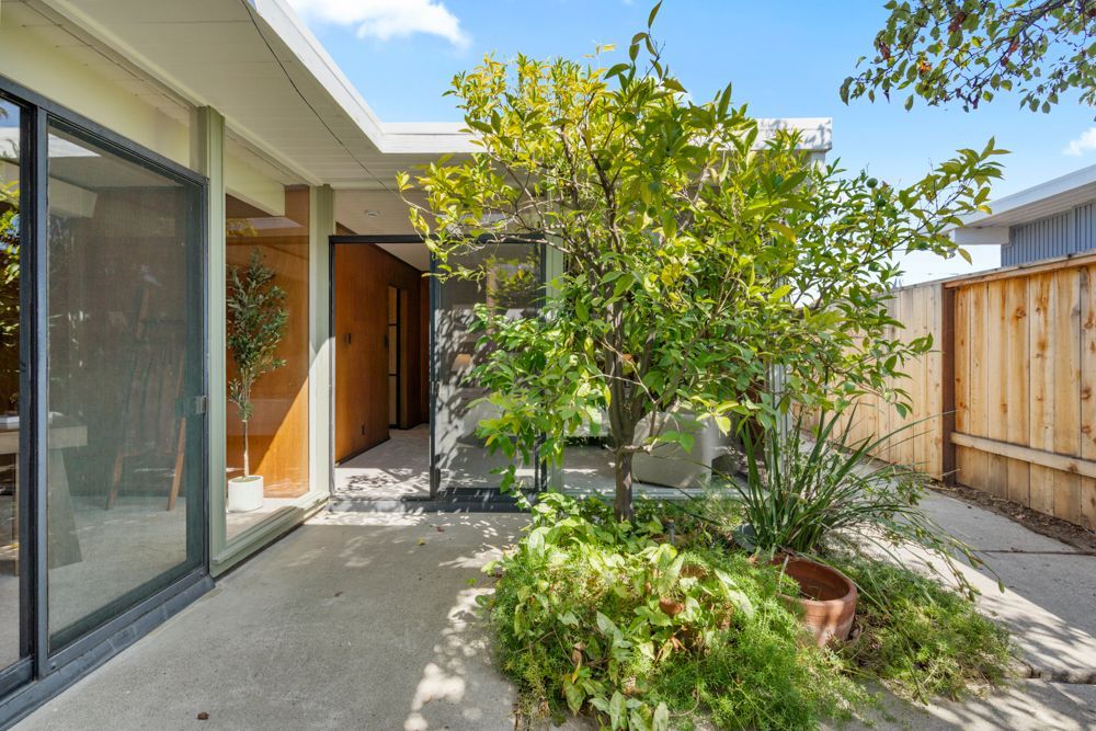 Private backyard with patio and garden vignettes, presented by Rumana Jabeen & Associates to illustrate lifestyle buyers seek and sellers can confidently showcase.